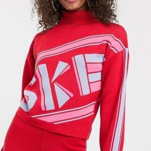 ASOS DESIGN ski slogan graphic sweater with racer stripe sleeves women’s size 14